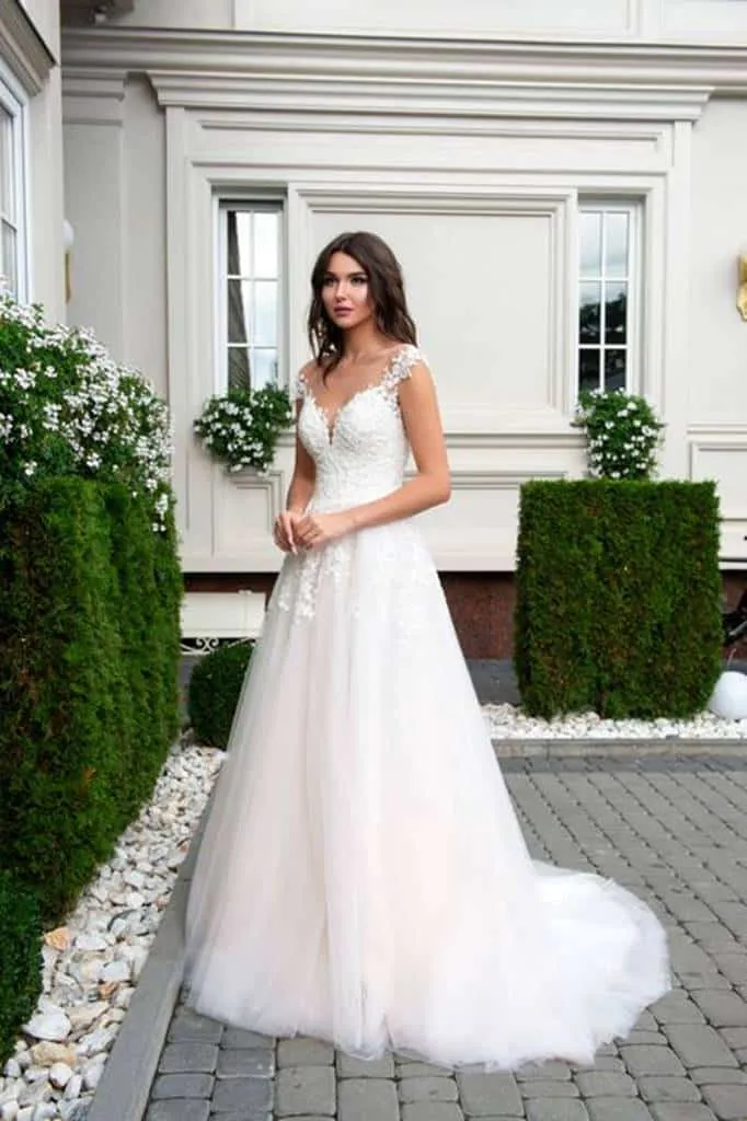 ---Glorious wedding dress for all ages with a flattering fit and a flared silhouette with a deep V-neckline--