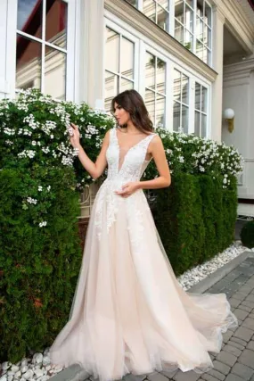 ---Italian designer wedding dress that combines the powder pink tulle skirt with the white lace bodice an ideal choice--