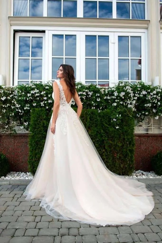 ---Italian designer wedding dress that combines the powder pink tulle skirt with the white lace bodice an ideal choice--