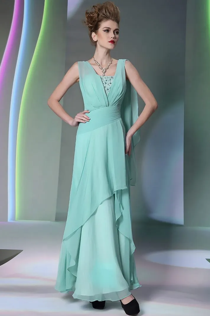 ---Long water green ceremony dress made of chiffon with bright decorations on the bustier--