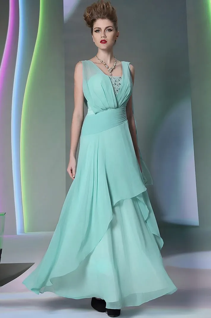 ---Long water green ceremony dress made of chiffon with bright decorations on the bustier--