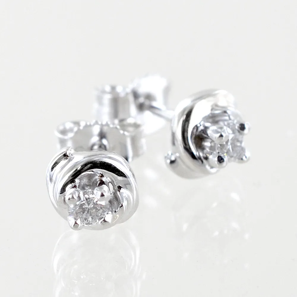 Orecchini punto luce ct 0.18 G - modello diamante in abbraccio